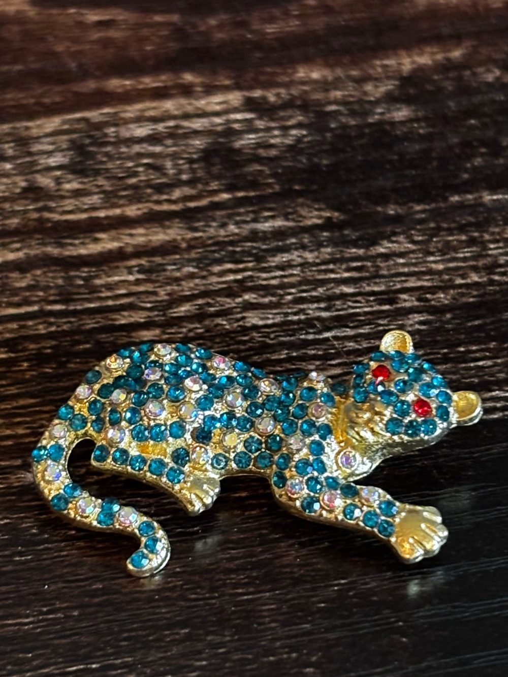 Gold-tone Pave Leopard Brooch with Blue Crystals‎